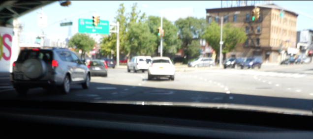 Sorry for the blurry screencap. But the right side of the car was 25% in the right lane in this photo.